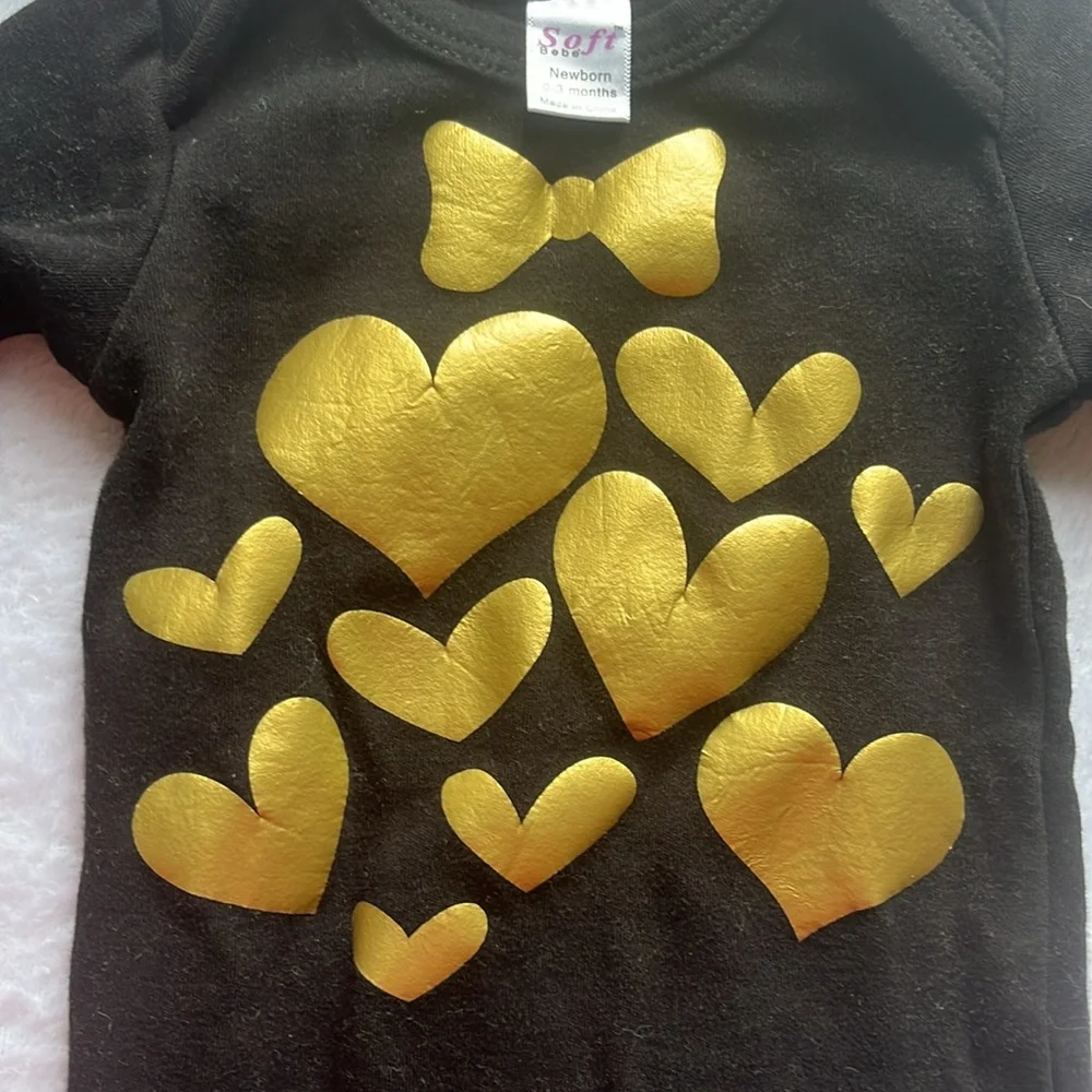 Black baby gown with gold heart and‎ bow detail